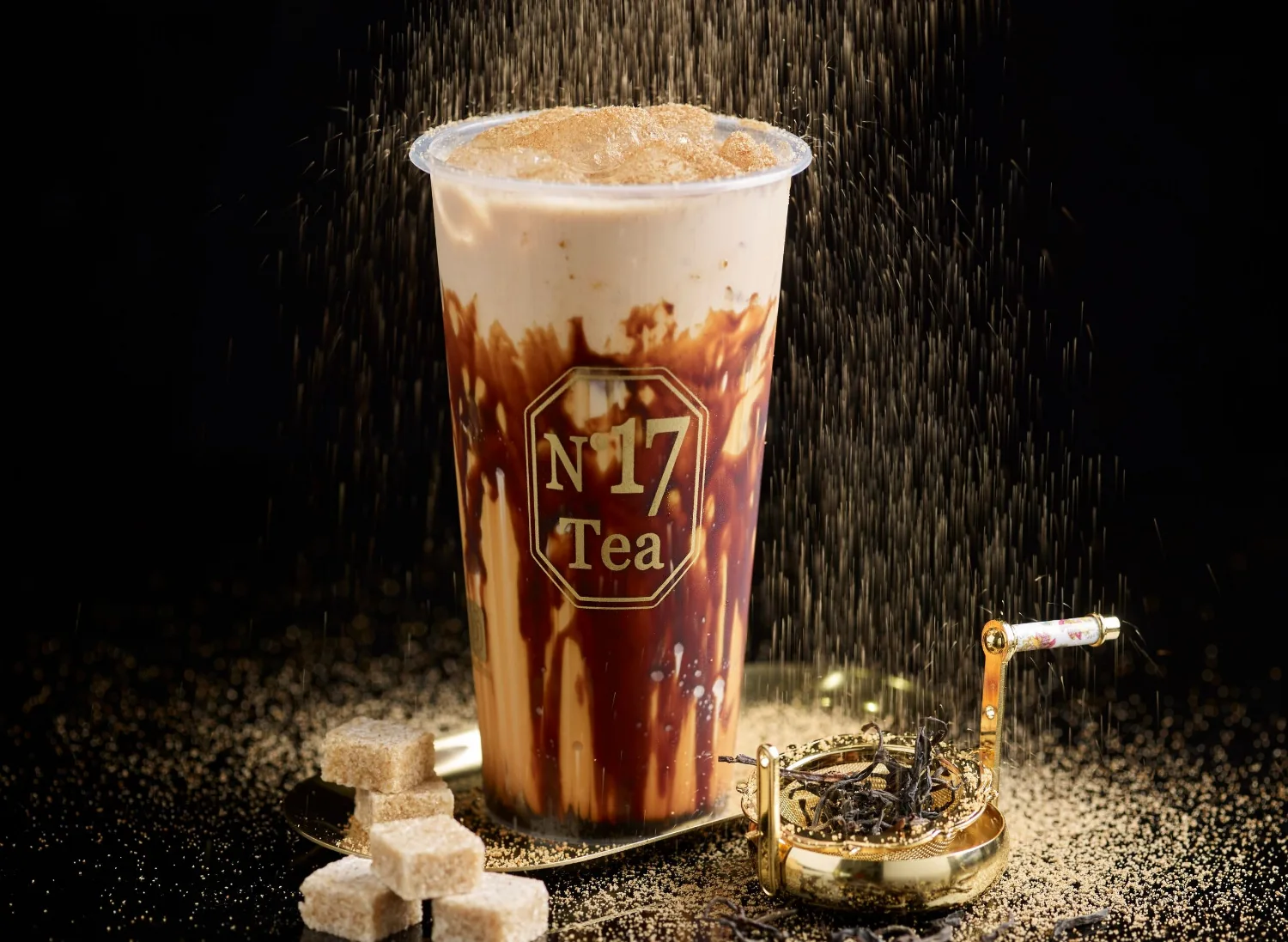 Roasted Brown Boba Milk Tea with brown-sugar streaks down the cup and boba pearls at the base